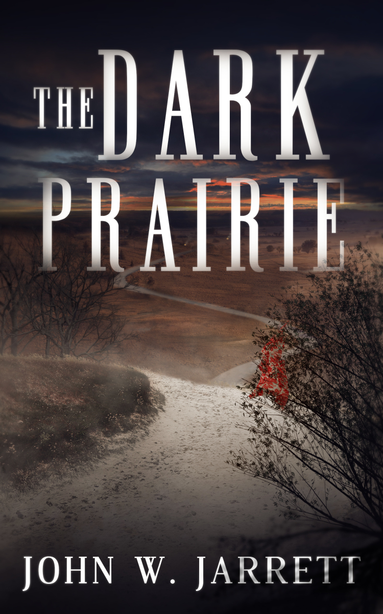 Cover of the book The Dark Prairie by John W. Jarrett. The image features a desolate prairie landscape under a dark, ominous sky at dusk. A winding path stretches through the barren terrain, with faint hints of trees and bushes on either side. The title, 'The Dark Prairie,' appears in large, bold letters across the top, while the author's name, John W. Jarrett, is displayed at the bottom.